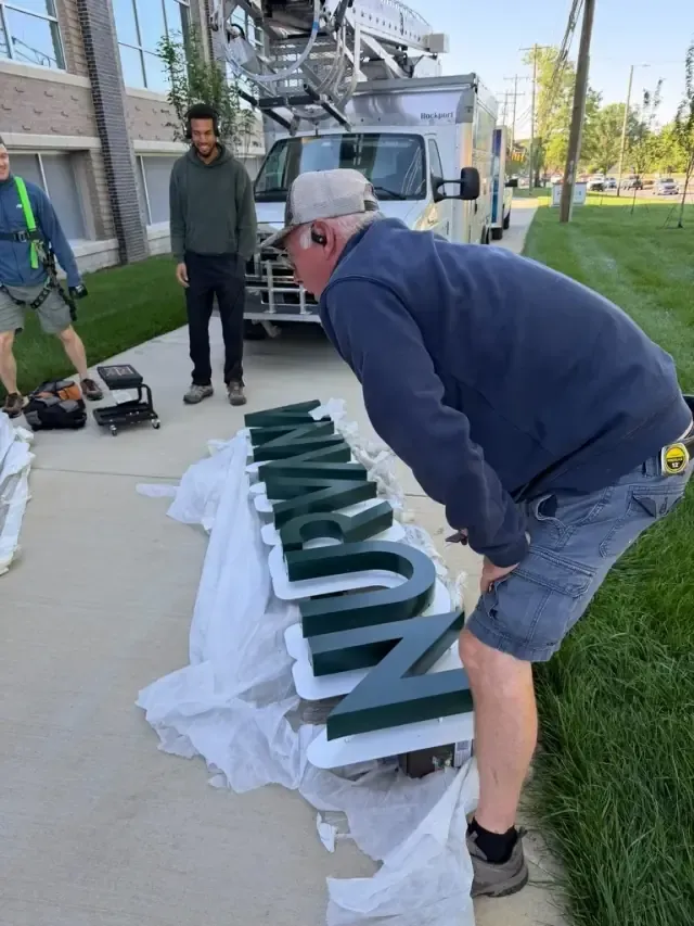 The individual Nurvana sign letters on site, ready to be mounted on the building exterior.